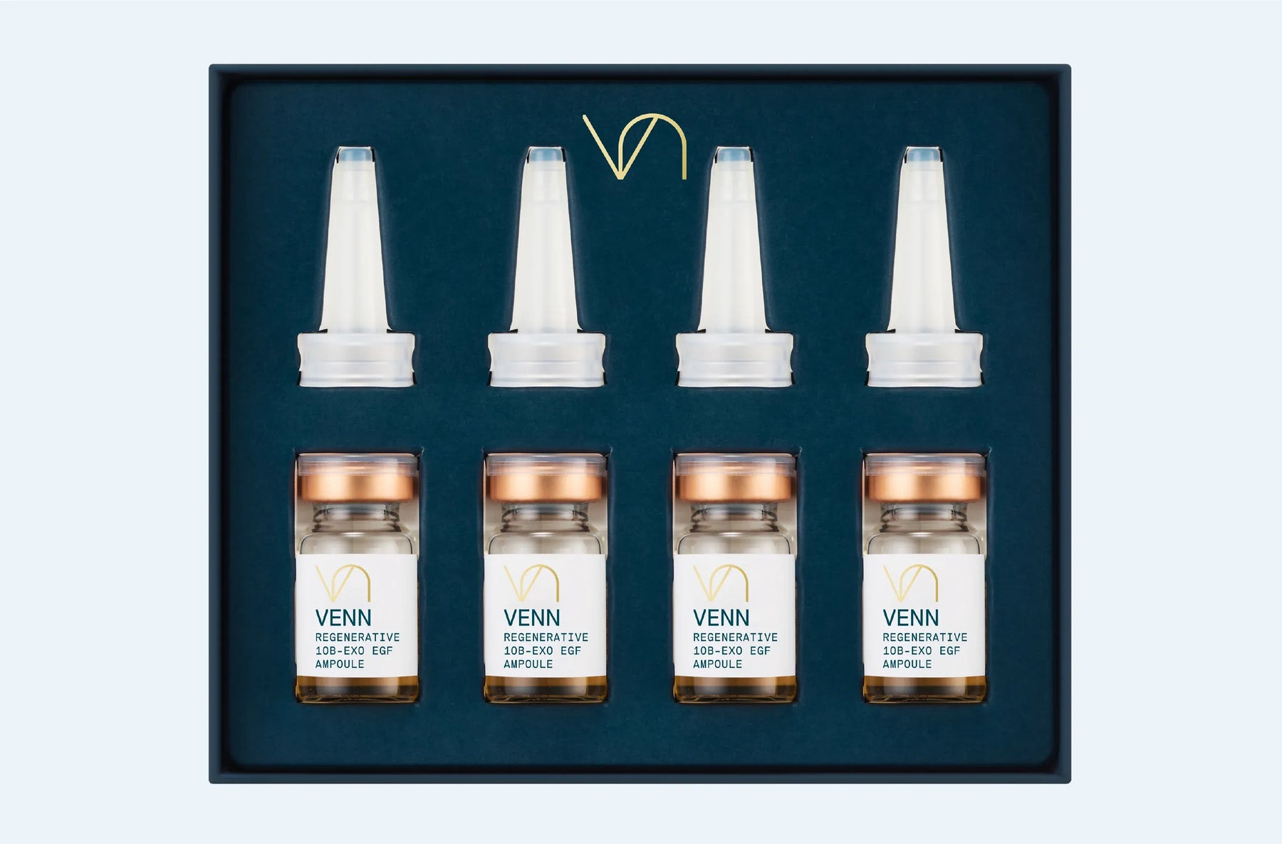 Set of VENN skincare ampoules in a dark blue box on a light gray background